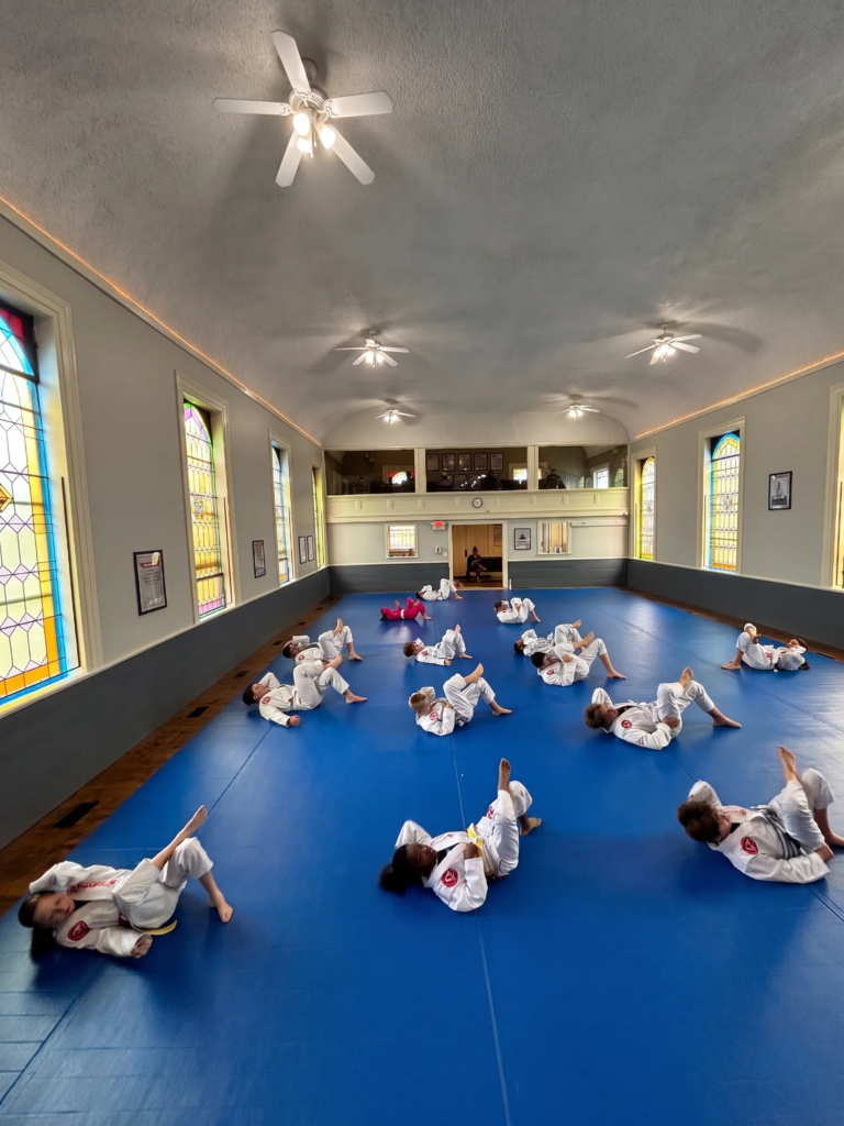 kids bjj warm up training self defense martial arts in gracie barra romeo MI